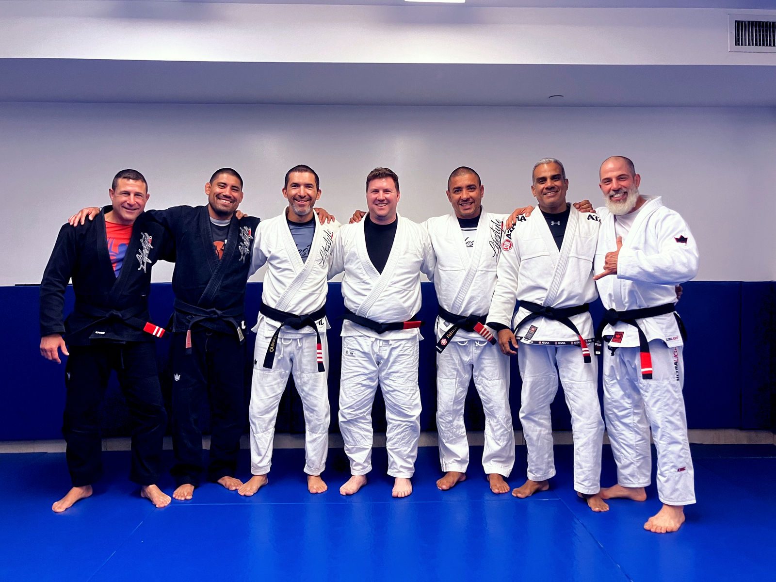 Lifestyle BJJ black belt instructors together on the mats